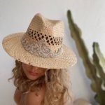 This unique straw cowboy is crafted with a natural straw material, the hat features a braided rose gold sfifa ornament for an extra sophisticated touch.