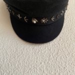 Stay casual and elegant with this unique upcycled black wool blend newsboy cap, embellished with intricate silver details.